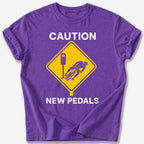 Caution: New Pedals T-Shirt — Heather Purple